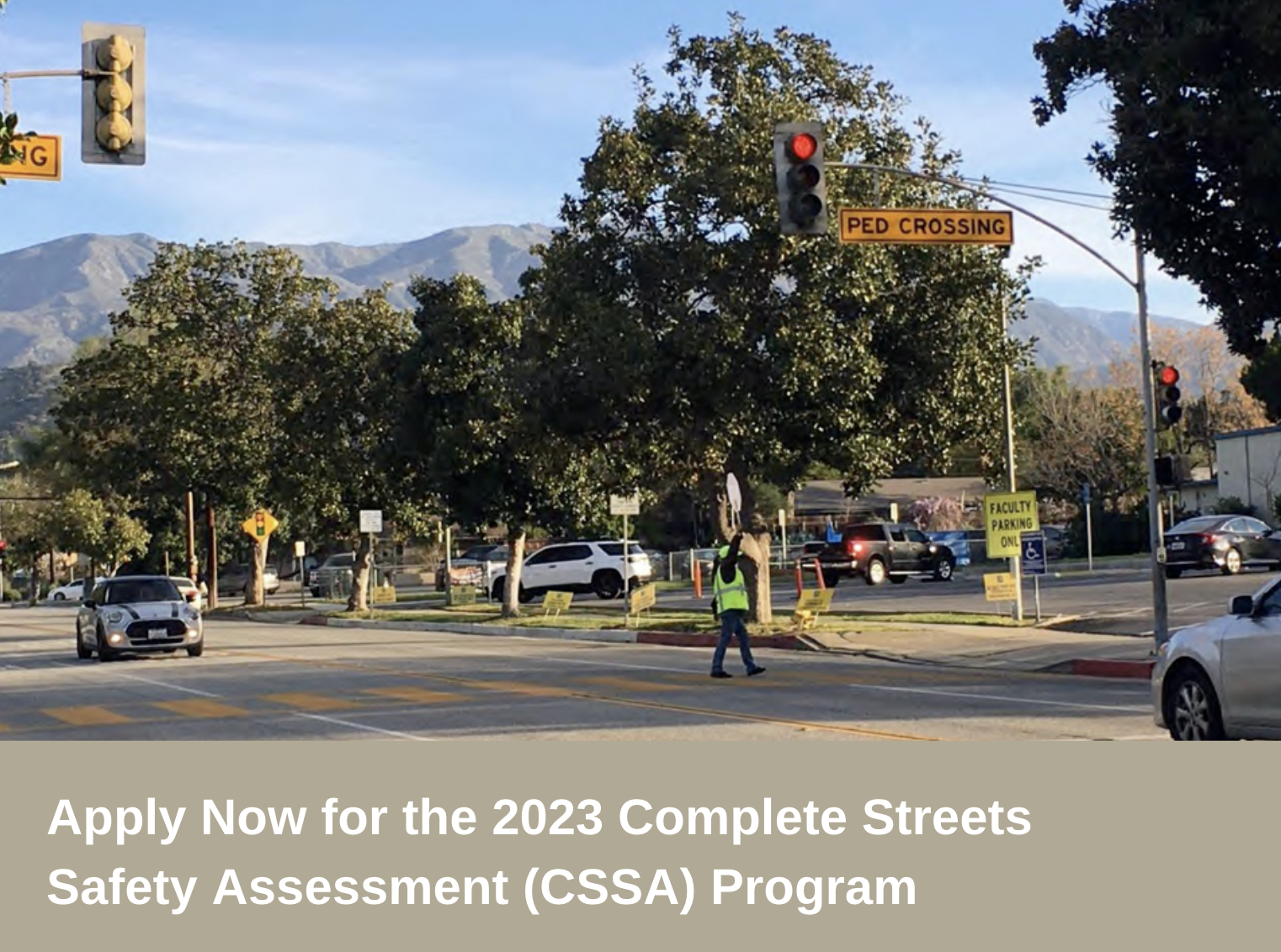 Crossing guard at a pedestrian crossing in Claremont, CA with white text on a beige box at the bottom "Apply Now for the 2023 Complete Streets Safety Assessment (CSSA) Program"