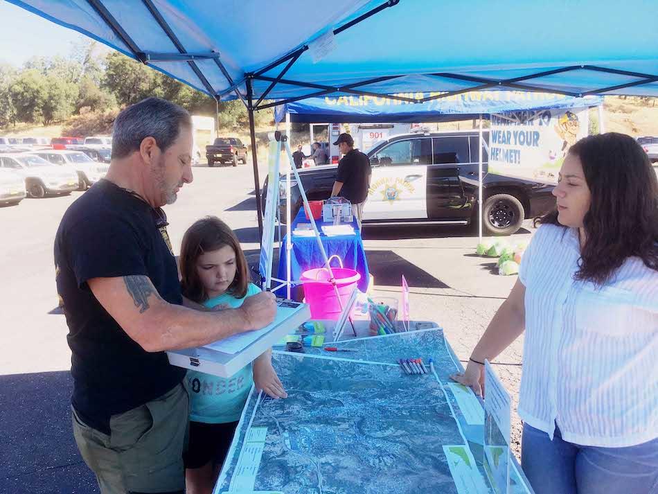 Family at table for bike rodeo