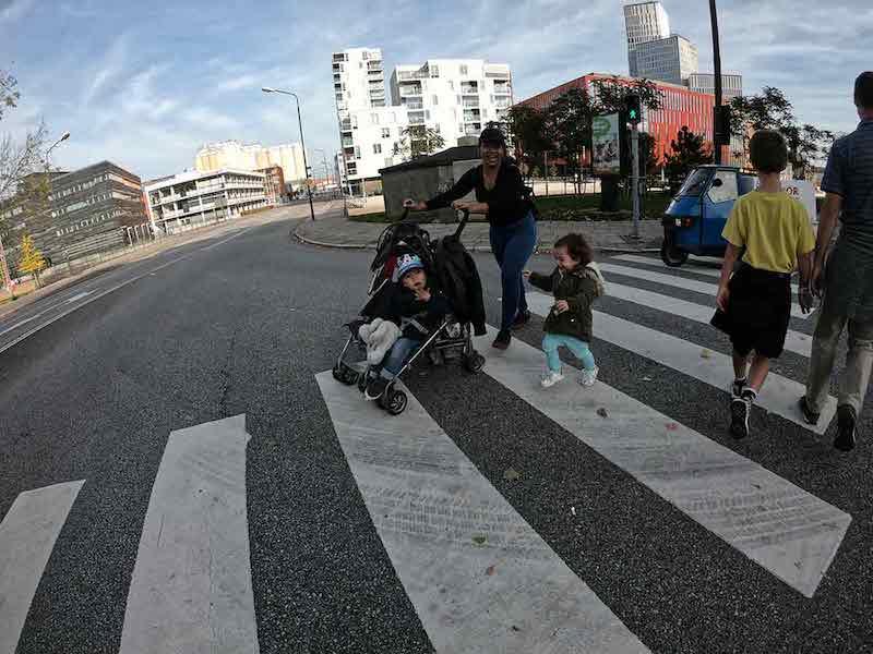 Family with stroller in crosswalk