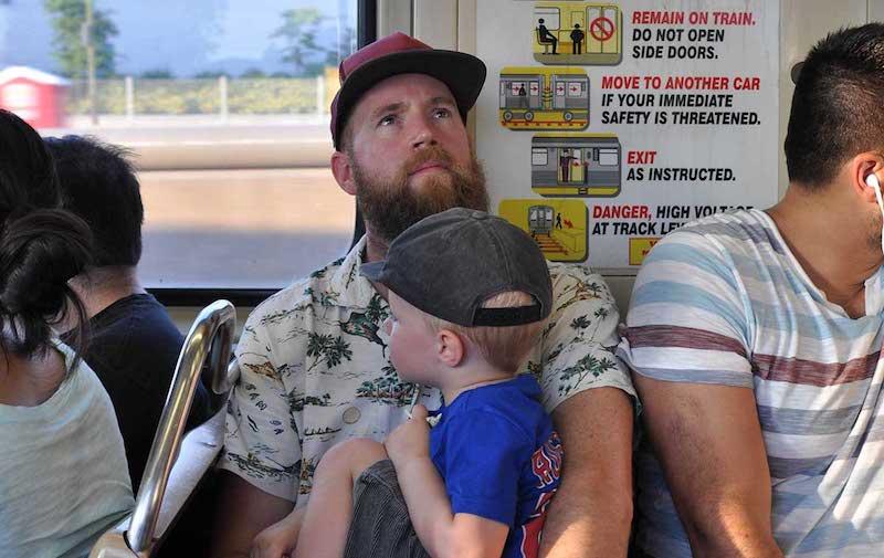 Father and son on train