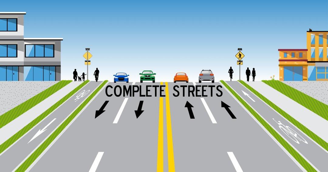 Graphic depicting a Complete Street, including bicyclists biking in a protected bike lane, pedestricans walking on safe sidewalks and cars driving in the middle of the road