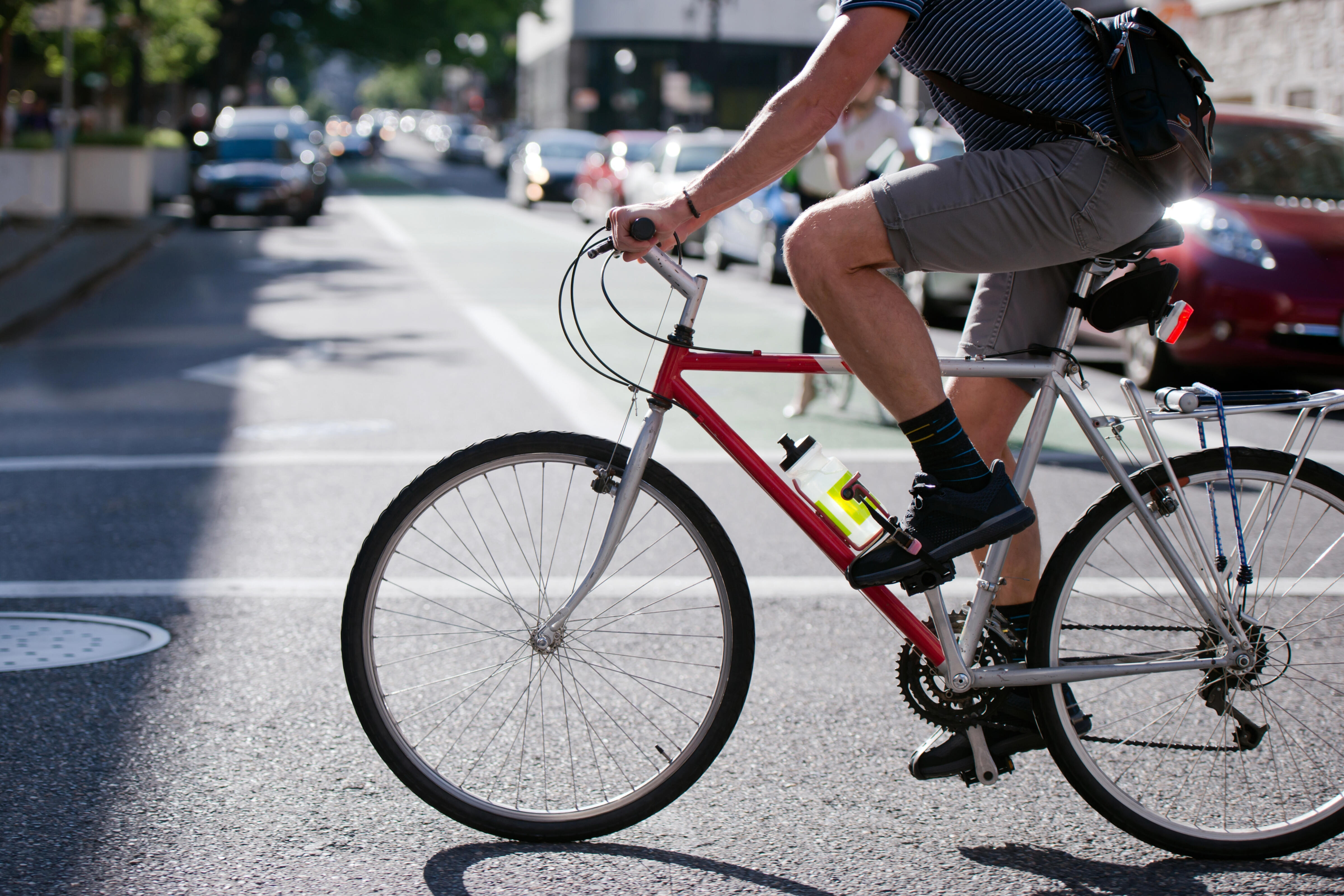 A person rides a bicycle on the street.