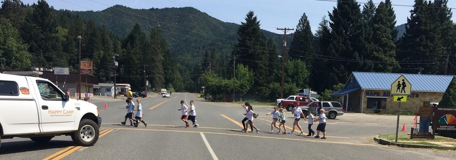 Children crossing the street in Happy Camp 