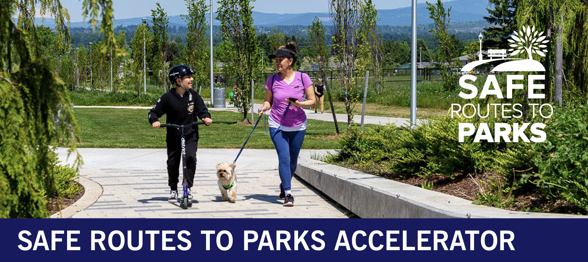 A parent walks a small dog while their child rides a scooter in a local park. The text reads "Safe Routes to Parks"and "Safe Routes to Parks Accelerator"