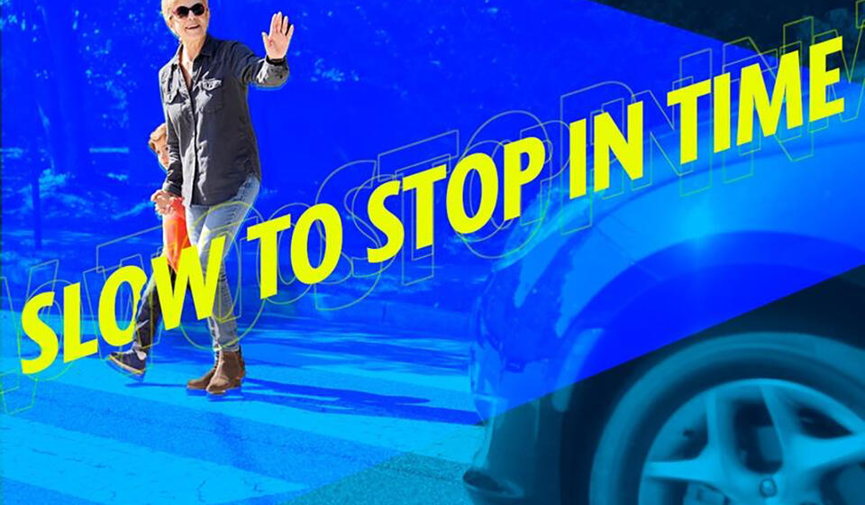 A car stops for a grandmother and child in a crosswalk with the following message: Slow to stop in time