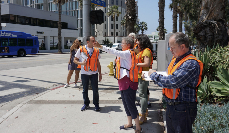 Community members and city staff on a walk audit at the corner of Lincoln Blvd and Wilshire Blvd