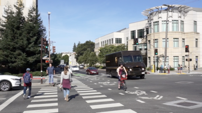 People walking and biking at intersection of Hearst and Oxford in Berkeley, CA